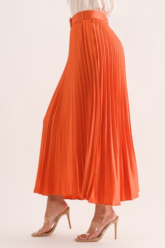 Belted pleated orange skirt